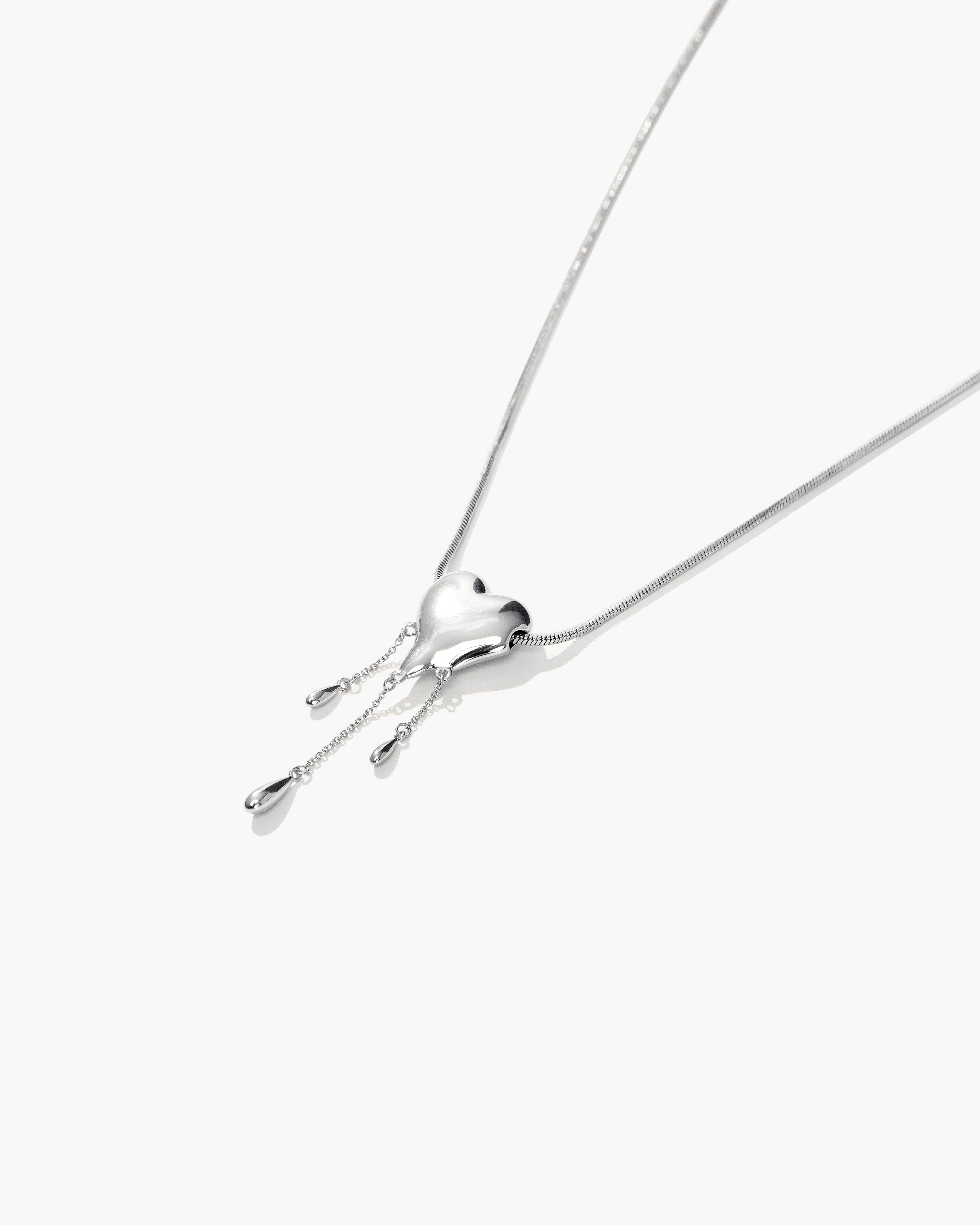 Venom’s Golden Drip Heart Necklace in Silver